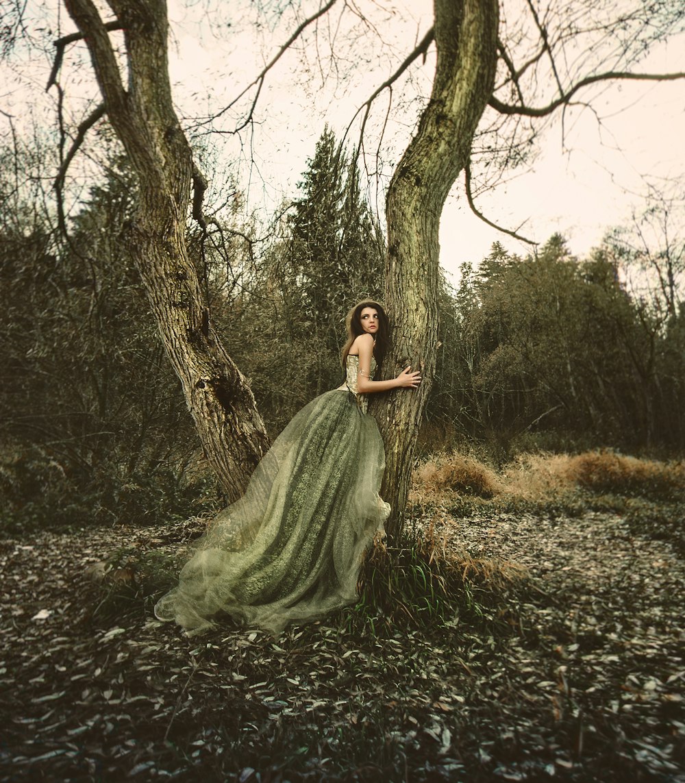 sepia photography of woman wearing princess dress hugging truck