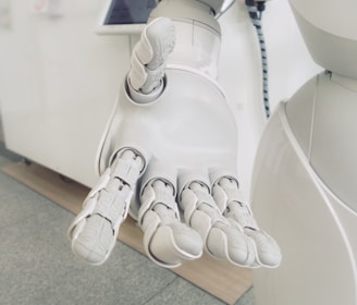 closeup photo of white robot arm