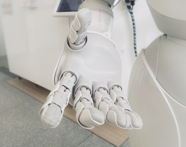 closeup photo of white robot arm