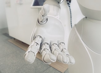 closeup photo of white robot arm