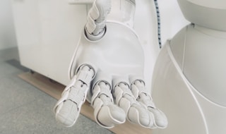 closeup photo of white robot arm