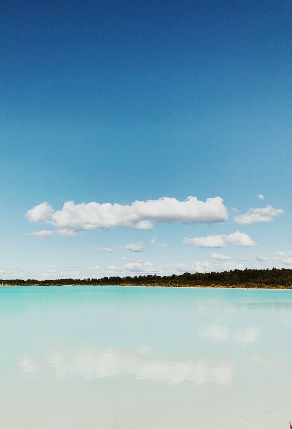 landscape photo of island under cloudy sky