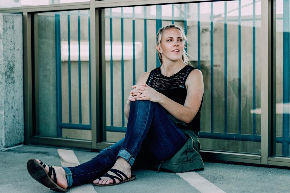 woman sitting down on floor