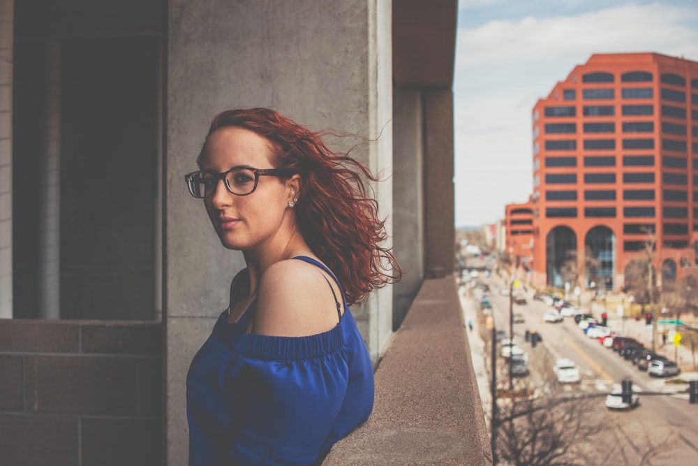 woman standing near balcony