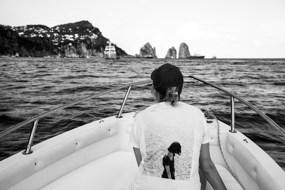 a person sitting on a boat in the water