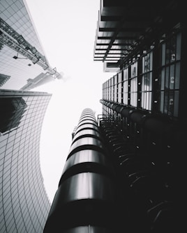 low-angle photography of skycraper buildings
