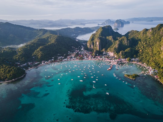landscape photography of island with boats in El Nido Philippines