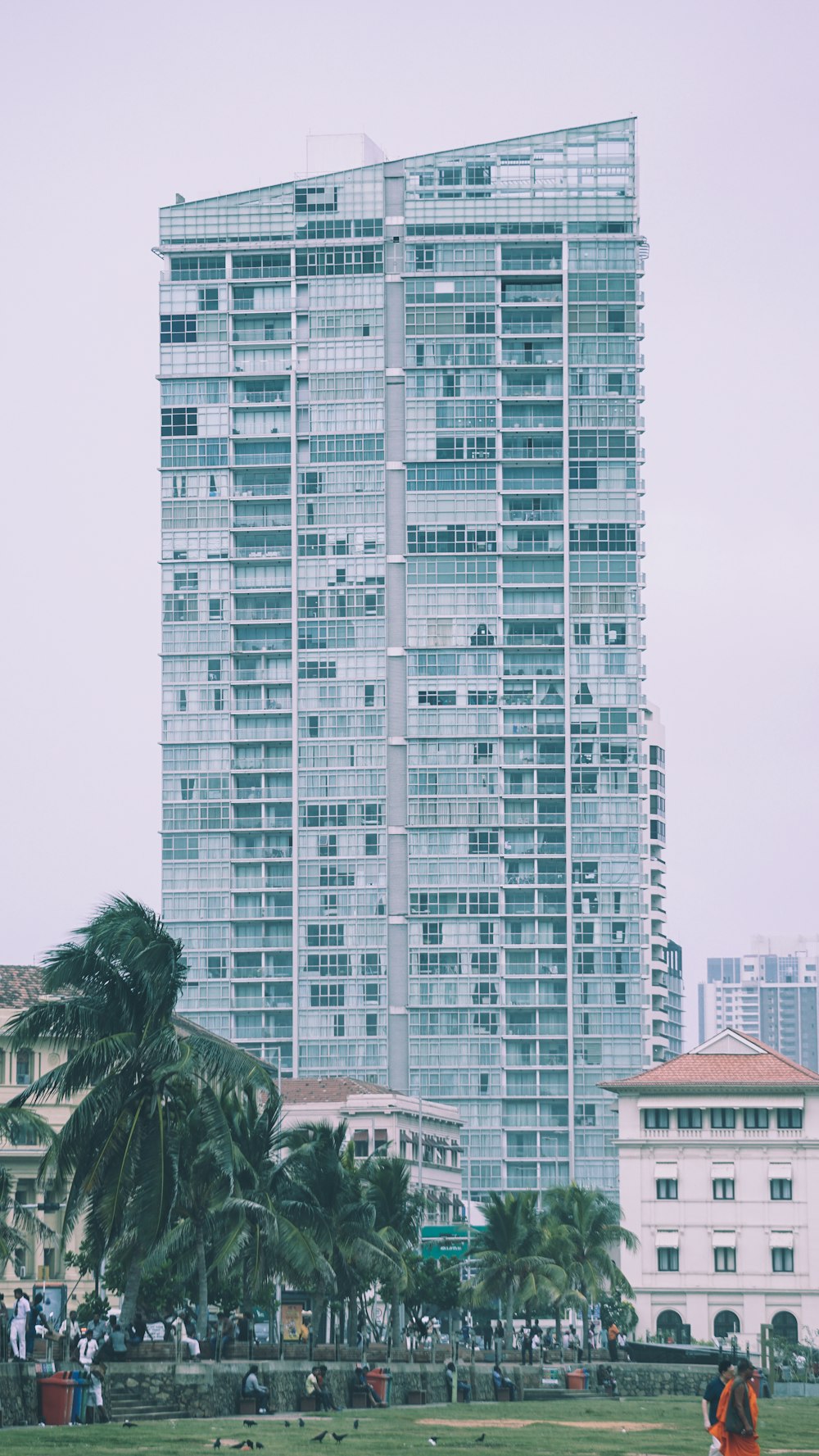 low angle photo of gray high-rise building