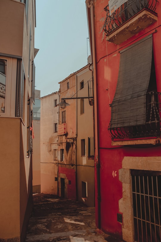 aisle between high-rise buildings at daytime in Girona Spain