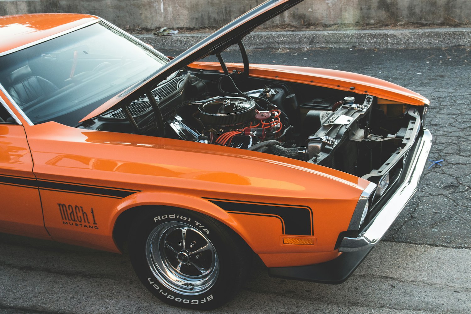 Orange car with opened hood