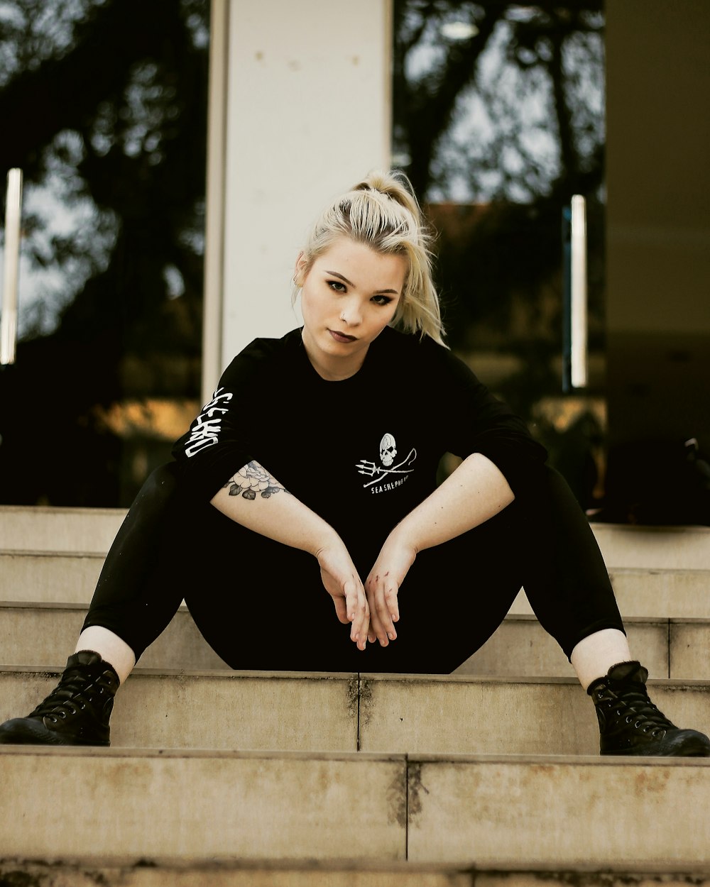 woman sitting on stair