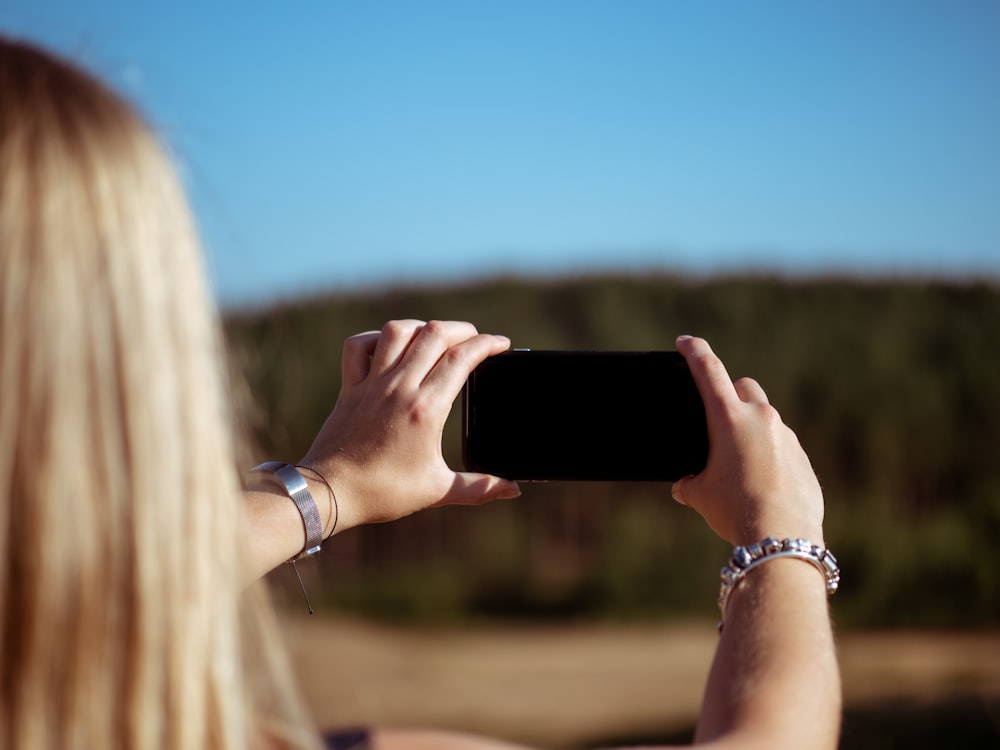 woman holding smartphone