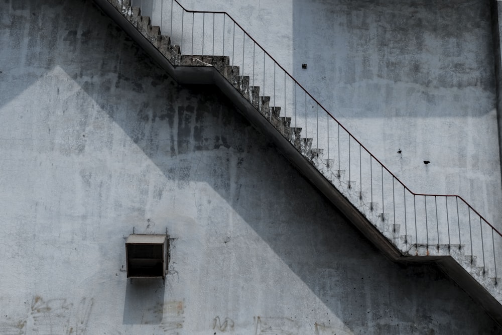 white concrete stairs beside building