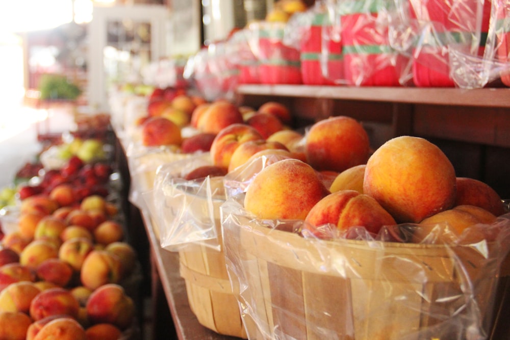 red and yellow apples on brown cardboard box