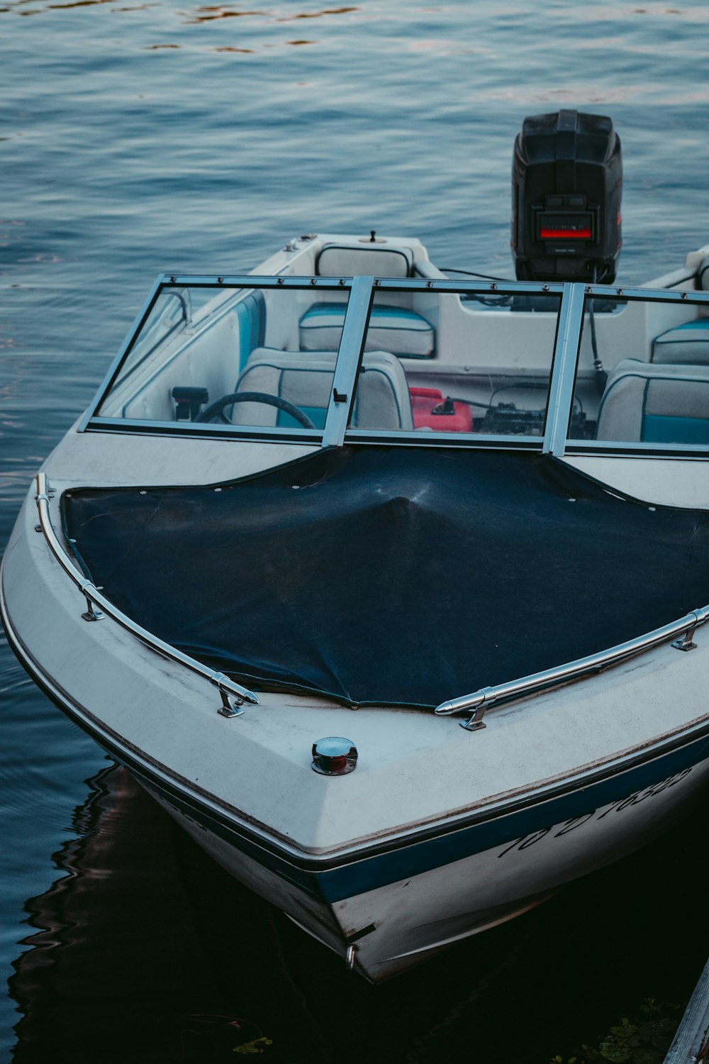 white, black, and gray motorboat during daytime