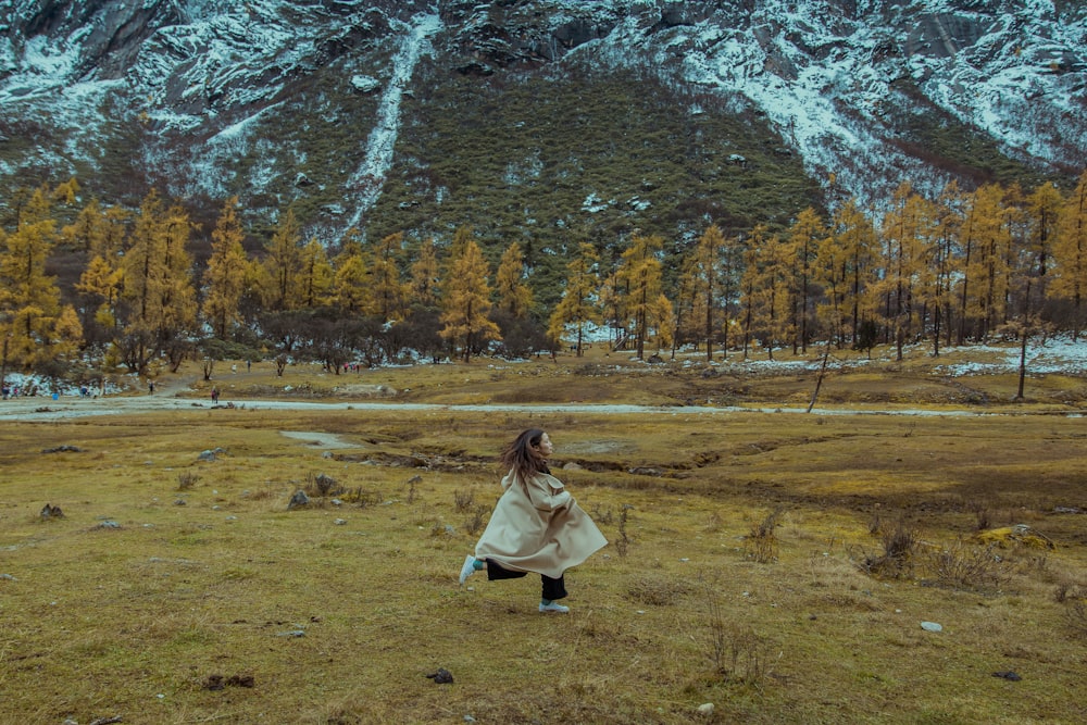 woman running on green grass