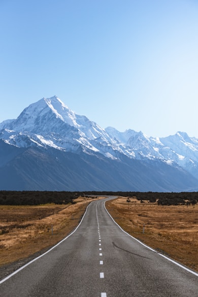 mountains covered with snow near road