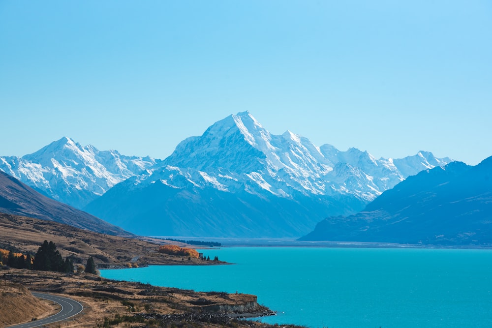 body of water surrounded by mountains