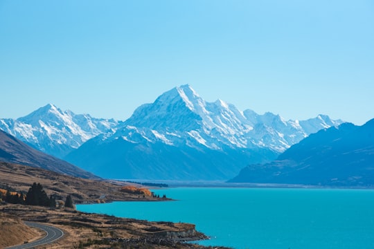 body of water surrounded by mountains in Lake Pukaki New Zealand