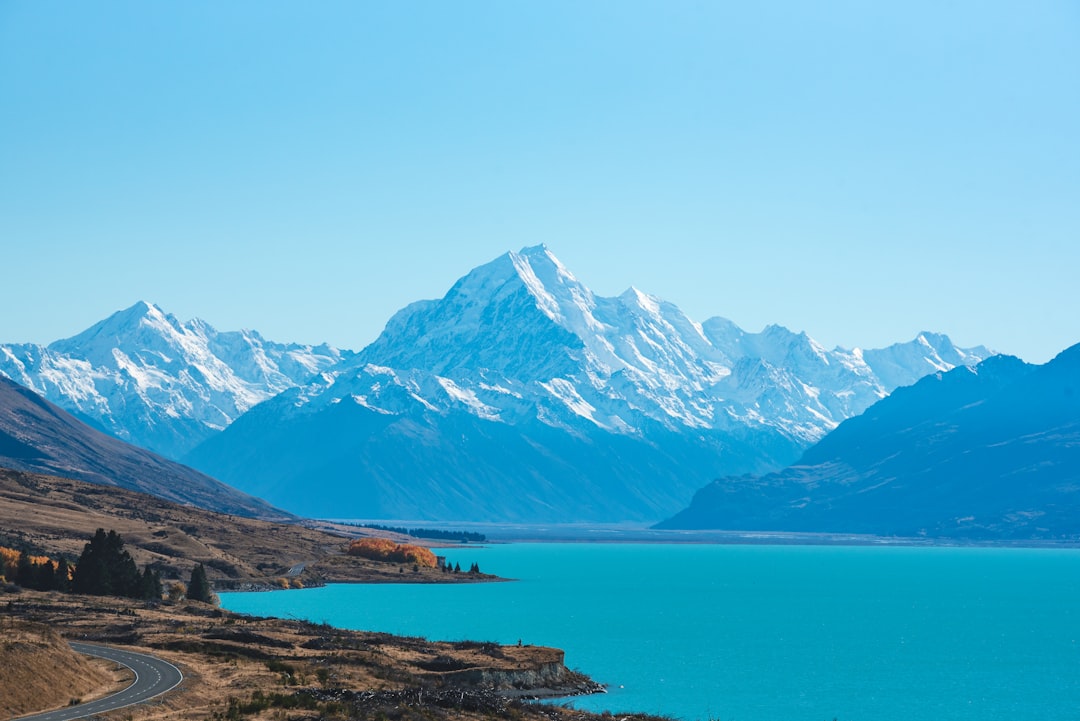body of water surrounded by mountains,