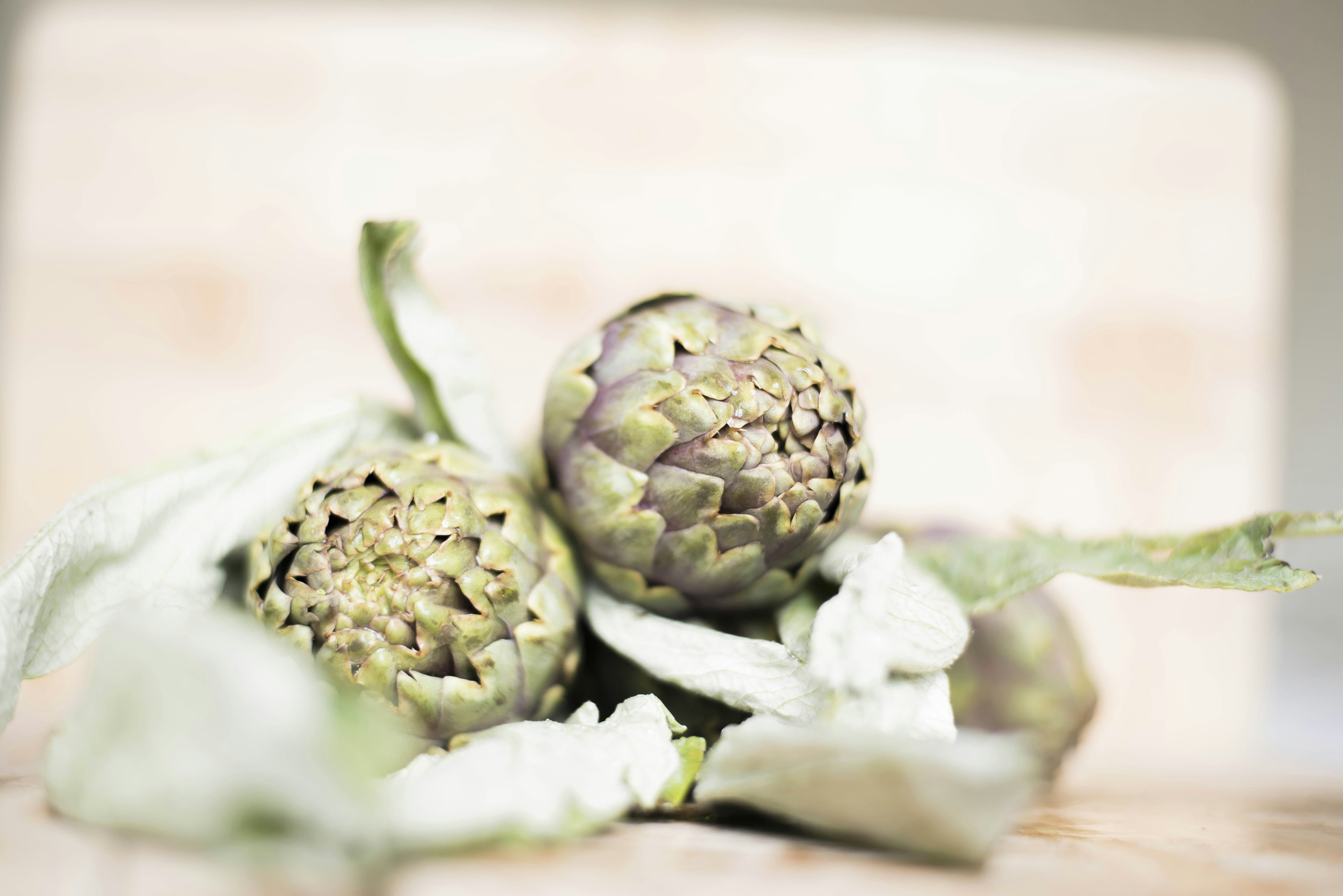 green vegetable on brown surface, Artichokes