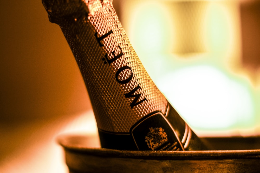 focus photography of Moet bottle inside bucket