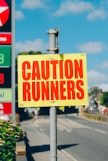 caution runners printed signage on road