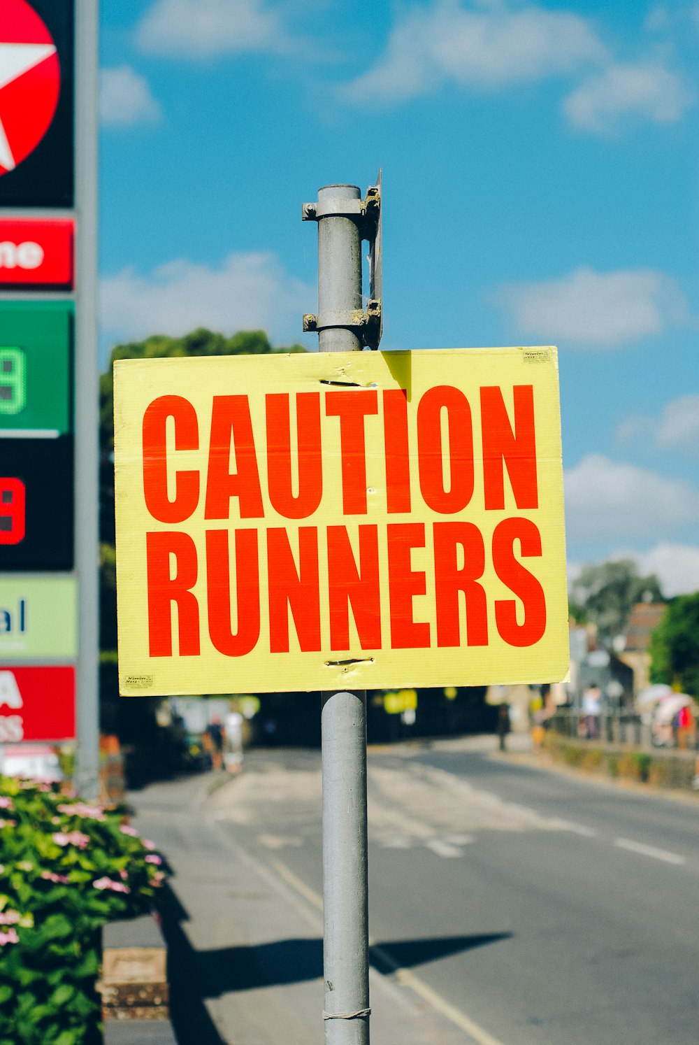 caution runners printed signage on road