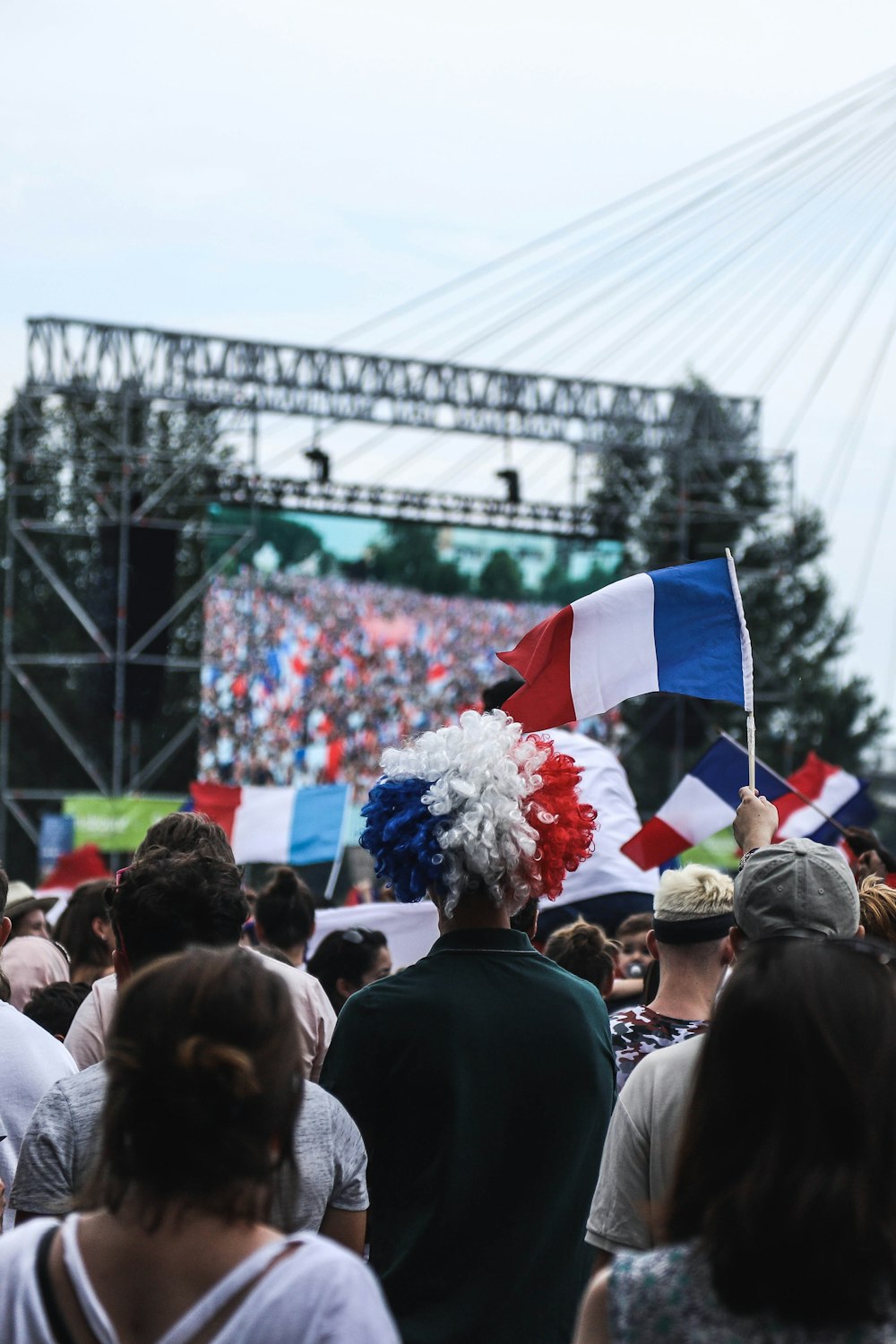 crowd of people gathered around stage during daytime