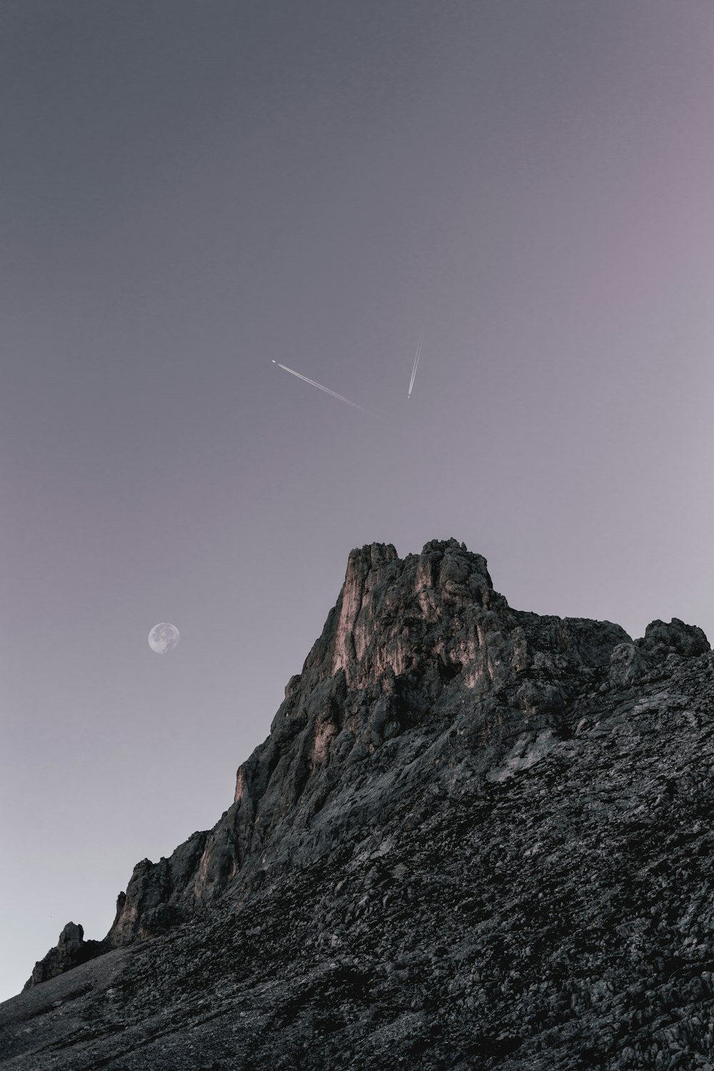 person showing mountain under clear sky