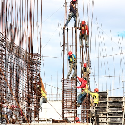 people working on building during daytime