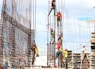 people working on building during daytime