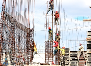 people working on building during daytime