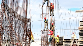 people working on building during daytime