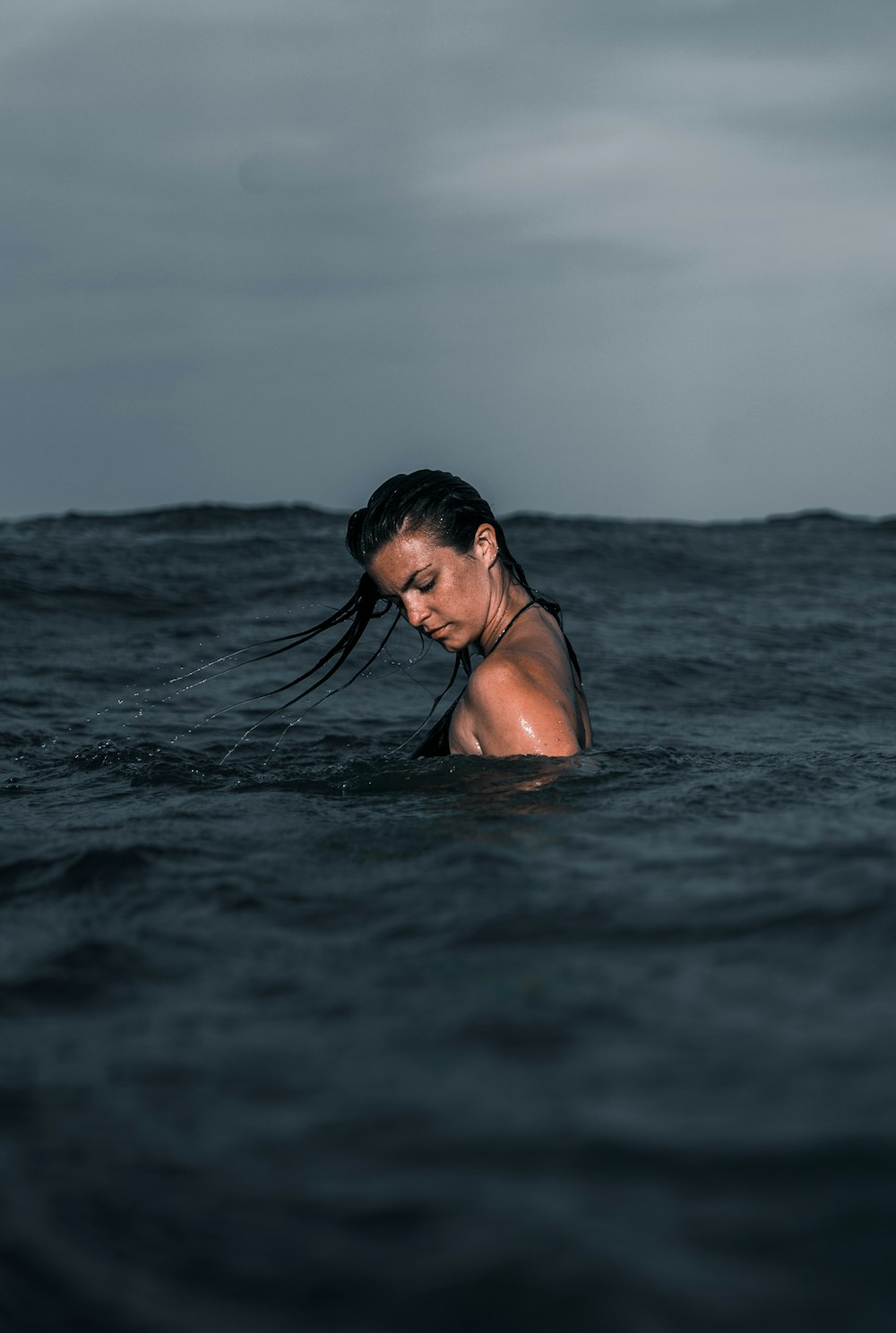 woman in body of water during day