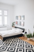 black platform bed with white mattress inside bedroom