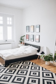 black platform bed with white mattress inside bedroom