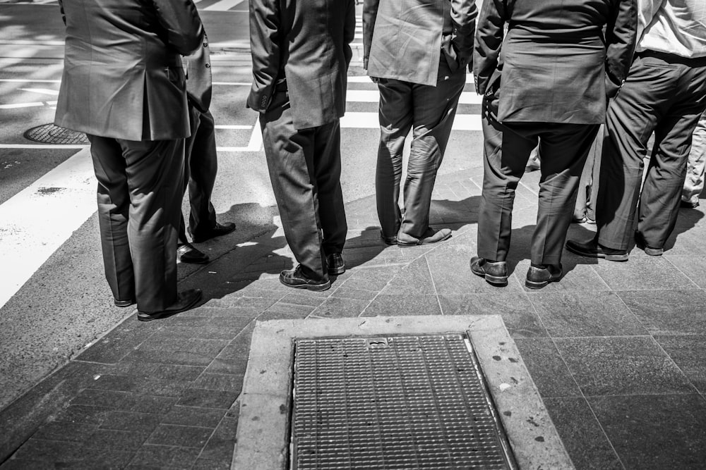 standing men in suit phto