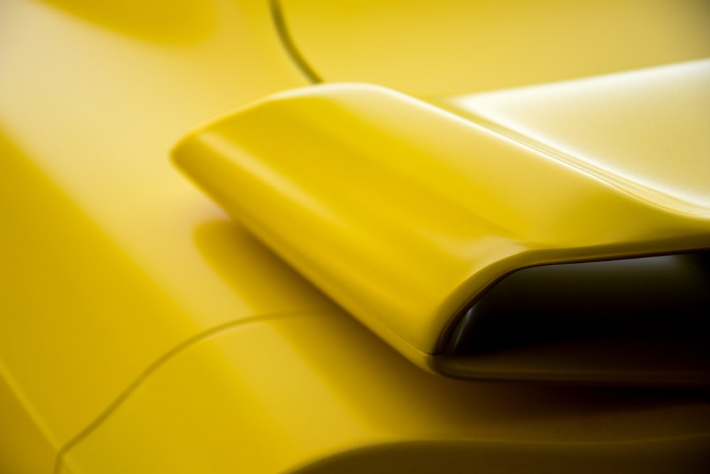 a close up view of a yellow car