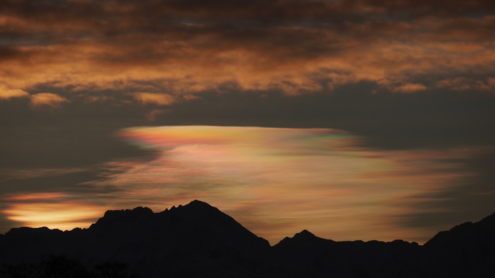 silhouette of mountain at golden hour