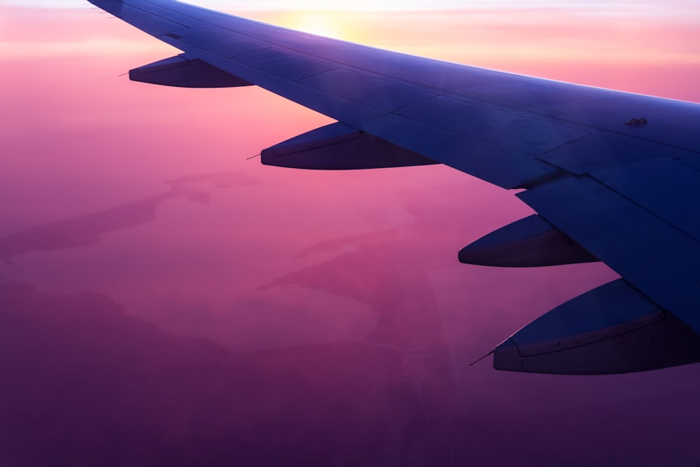 airplane wing during golden hour