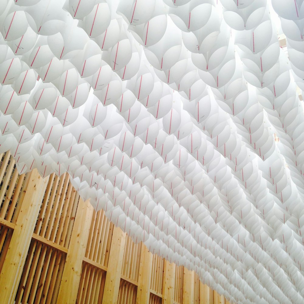 minimalist photography of hanged white paper buntings