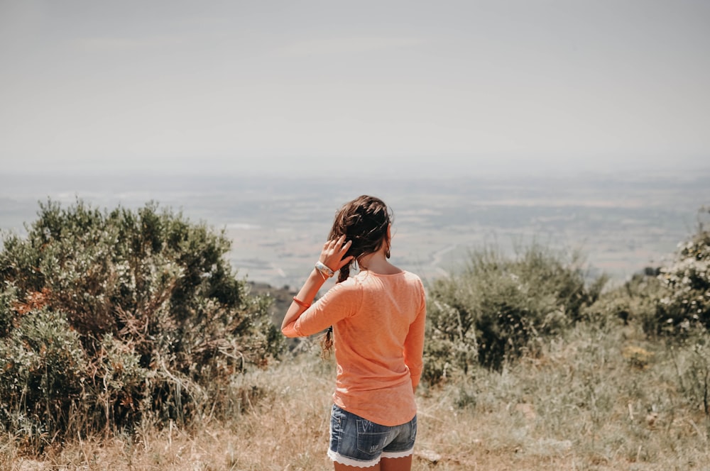 woman standing on grass field