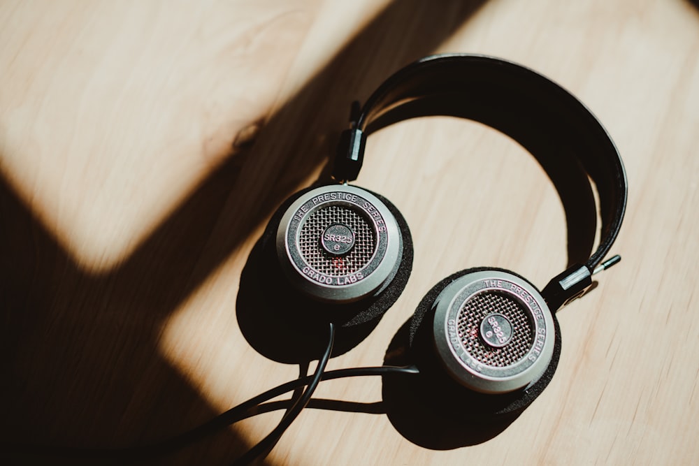 black and gray corded headphones