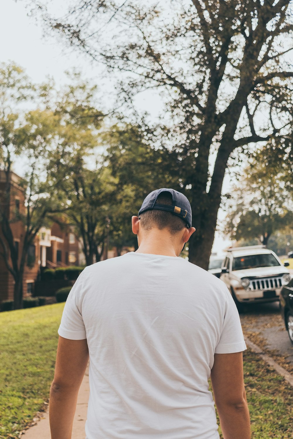 man walking in sidewalk