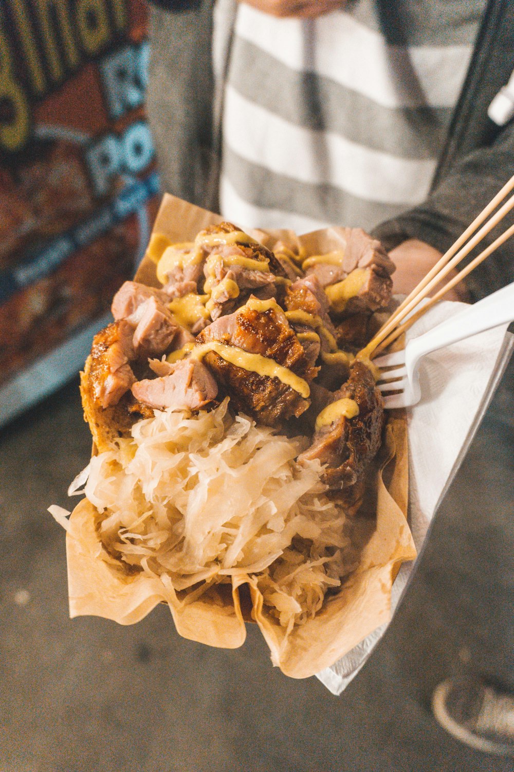 person showing meat with sauce in plate