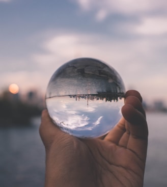 person holding crystal ball