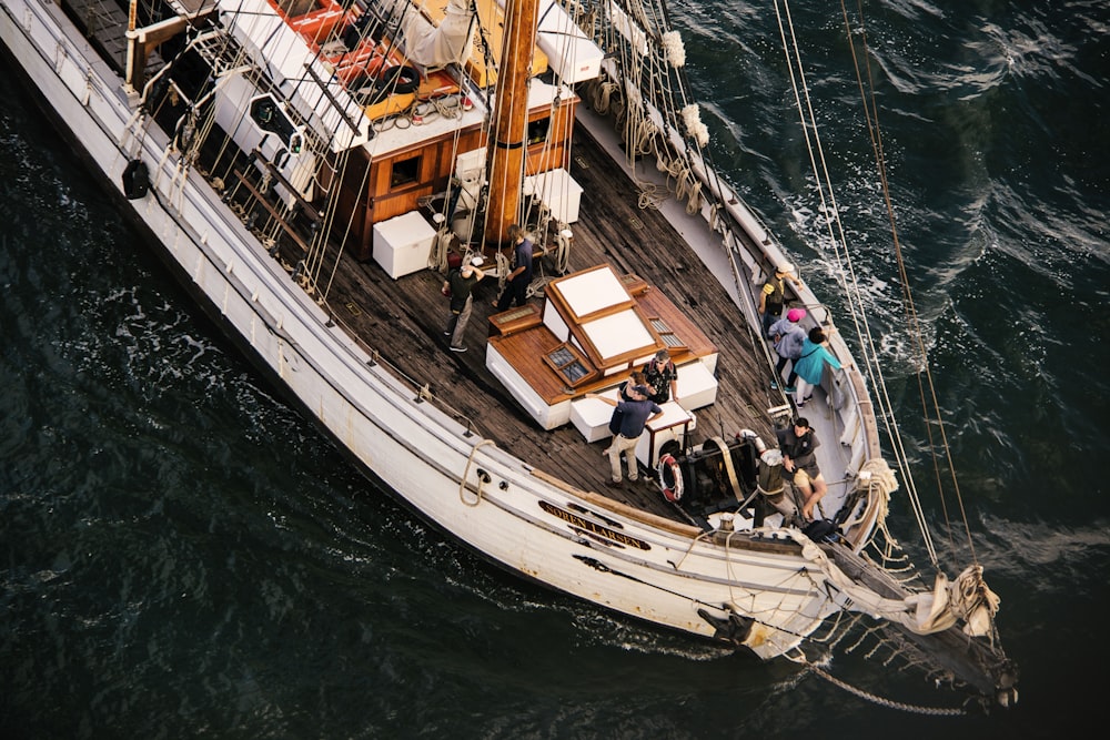 group of people standing on boat