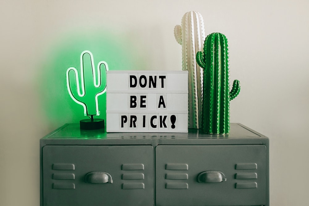 assorted cactus decors on file cabinet