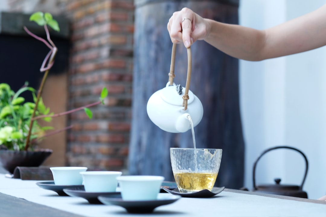 person holding kettle